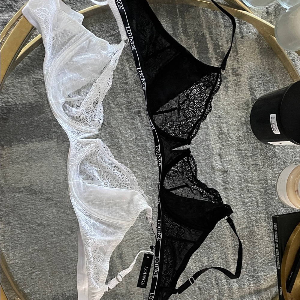 Lounge underwear. Black lace bra and white lace bra.